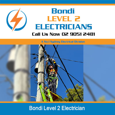 Level 2 electrician climbing power pole to work on overhead lines in Bondi