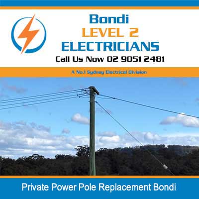 Wooden power pole for replacement with lines in Bondi